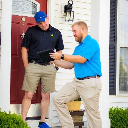 Brad and client in a pest control meeting